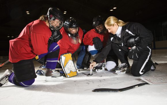 Kids Sports_Young Women Hockey Coach on Ice why hockey associations use epact