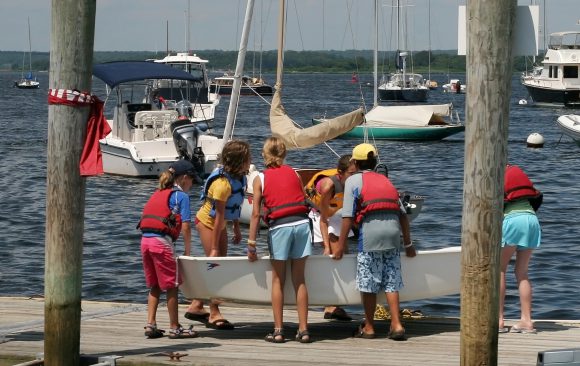 Kids around a boat